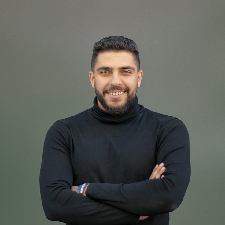 Analisa Rao, Lead Design Curator at ClusterMeadowCalm, reviewing corporate floral arrangements