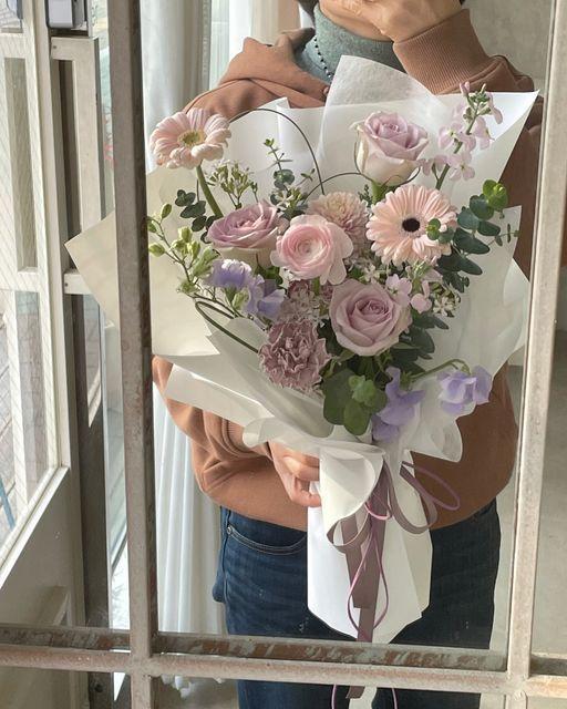 Professional floral arrangement in modern corporate setting